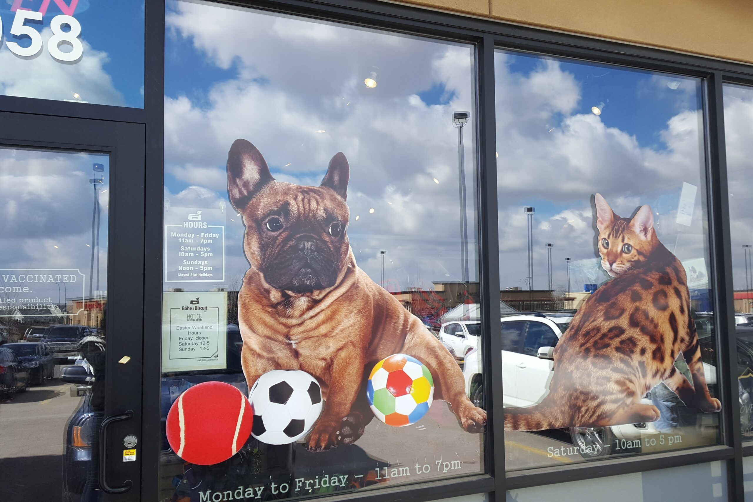 clear decal for store's front windows design and install by Landon Graphics and Signs Edmonton